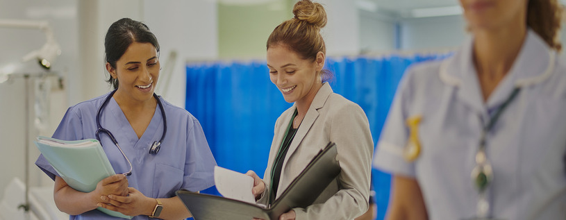 Healthcare Services Administration professional working in a medical setting.